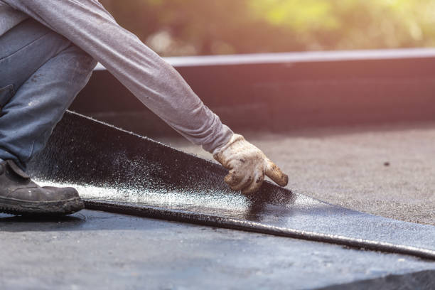 Professional Waterproofing technician working in Shepherd, MI
